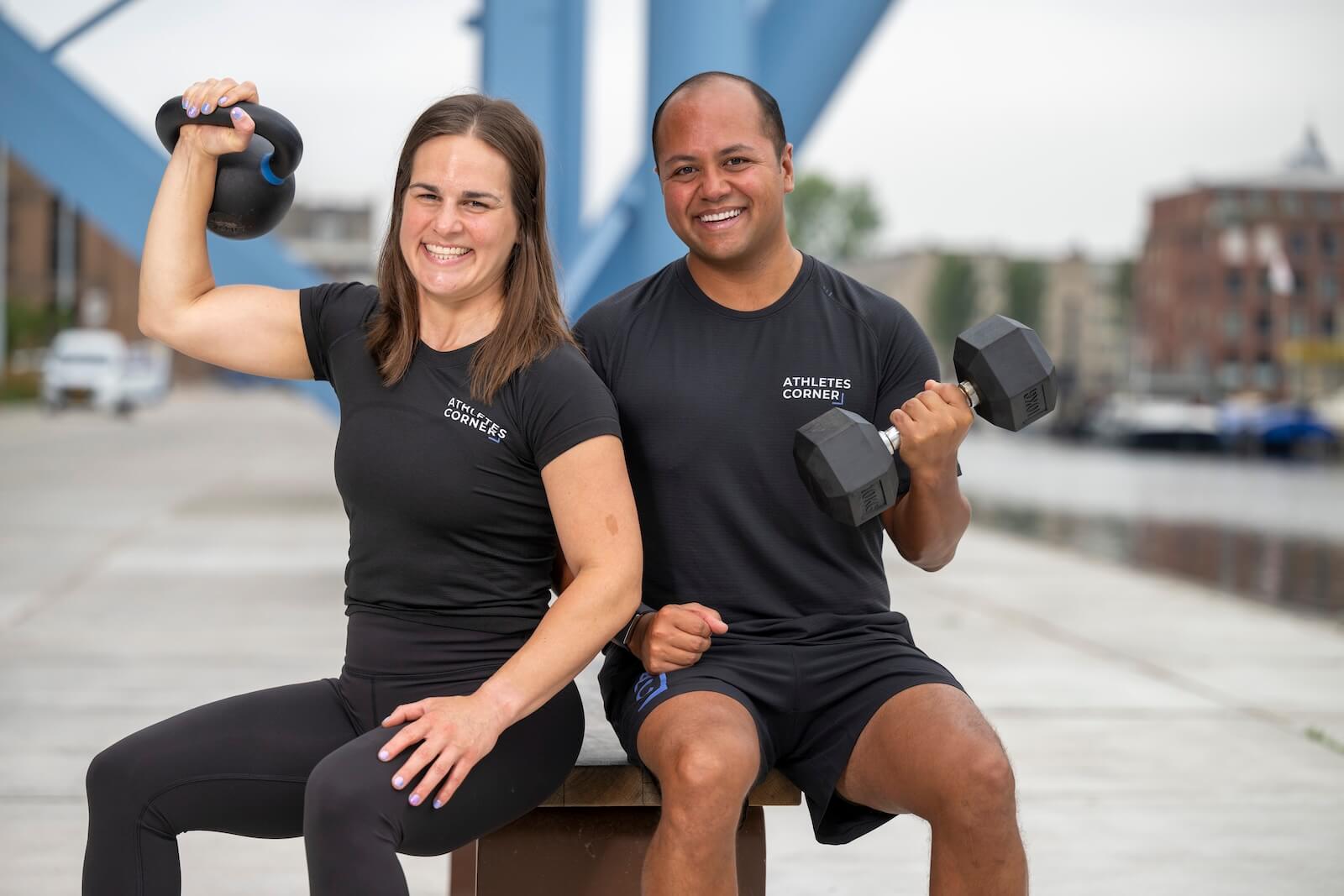 Contact us image of Gabriella and John-Ricardo holding dumbbells